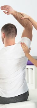 Doctor working with patient in hospital. Rehabilitation physiotherapy